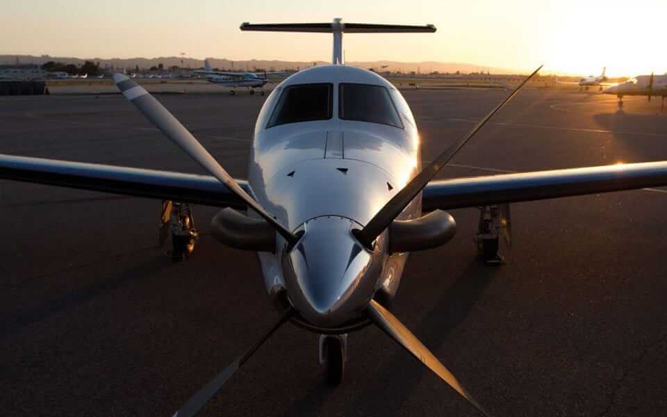 a small airplane sitting on top of an airport tarmac