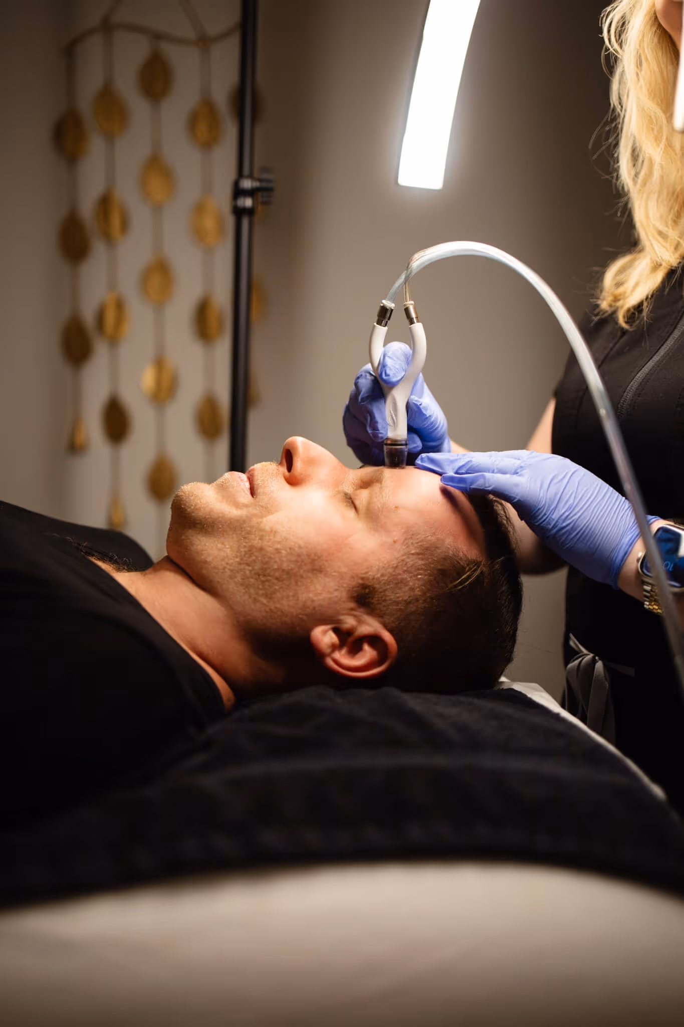 Client receiving Laser Facial in Columbus Ohio treatment for acne-prone skin med spa setting