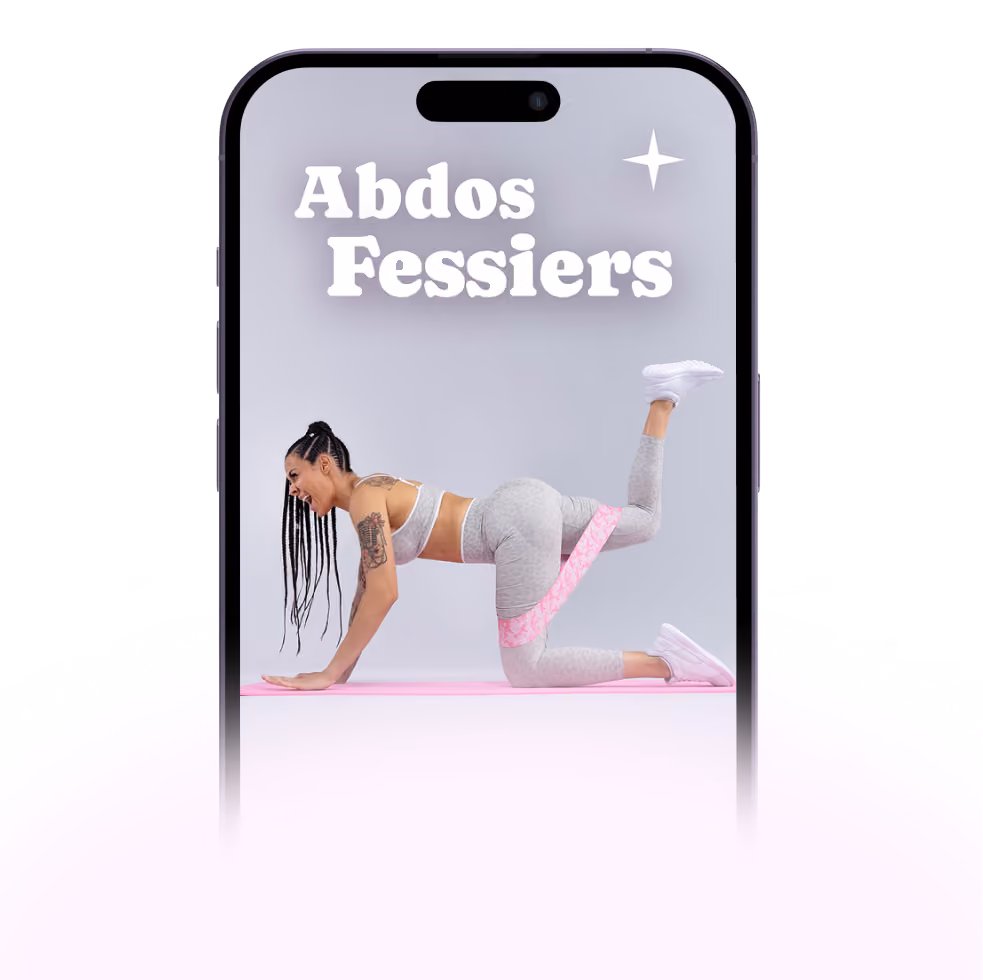 A woman with braided hair and tattoos performs a quadruped leg lift exercise using a pink resistance band on her raised left leg, on a pink exercise mat, with the text 'Abdos Fessiers' in white above her inside a smartphone frame.