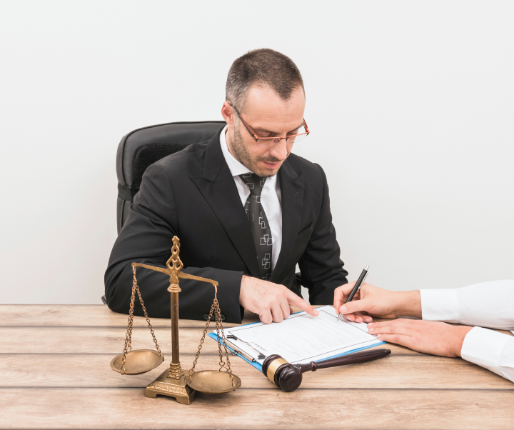 lawyer writing on his desk