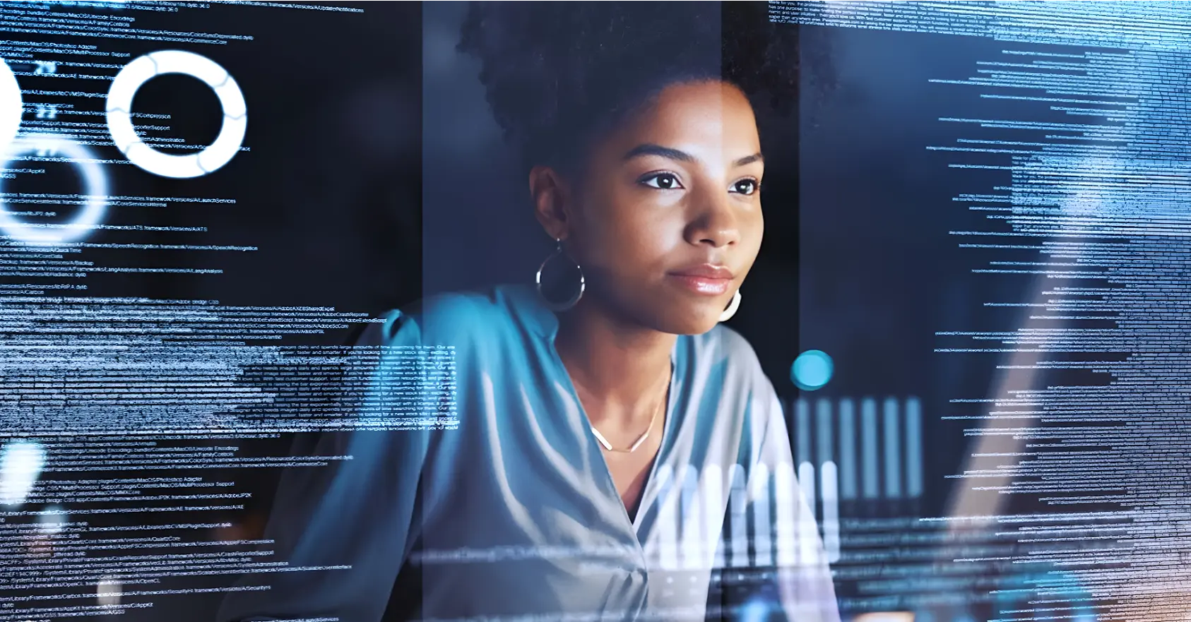 A woman looking at computer screen holograms