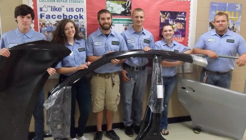 A group of people standing next to each other.