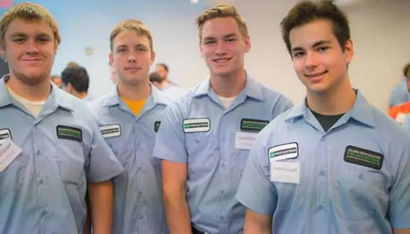 A group of young men standing next to each other.