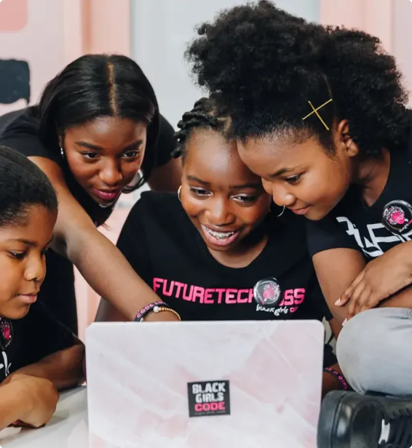 A tall building with a tree in front of it.