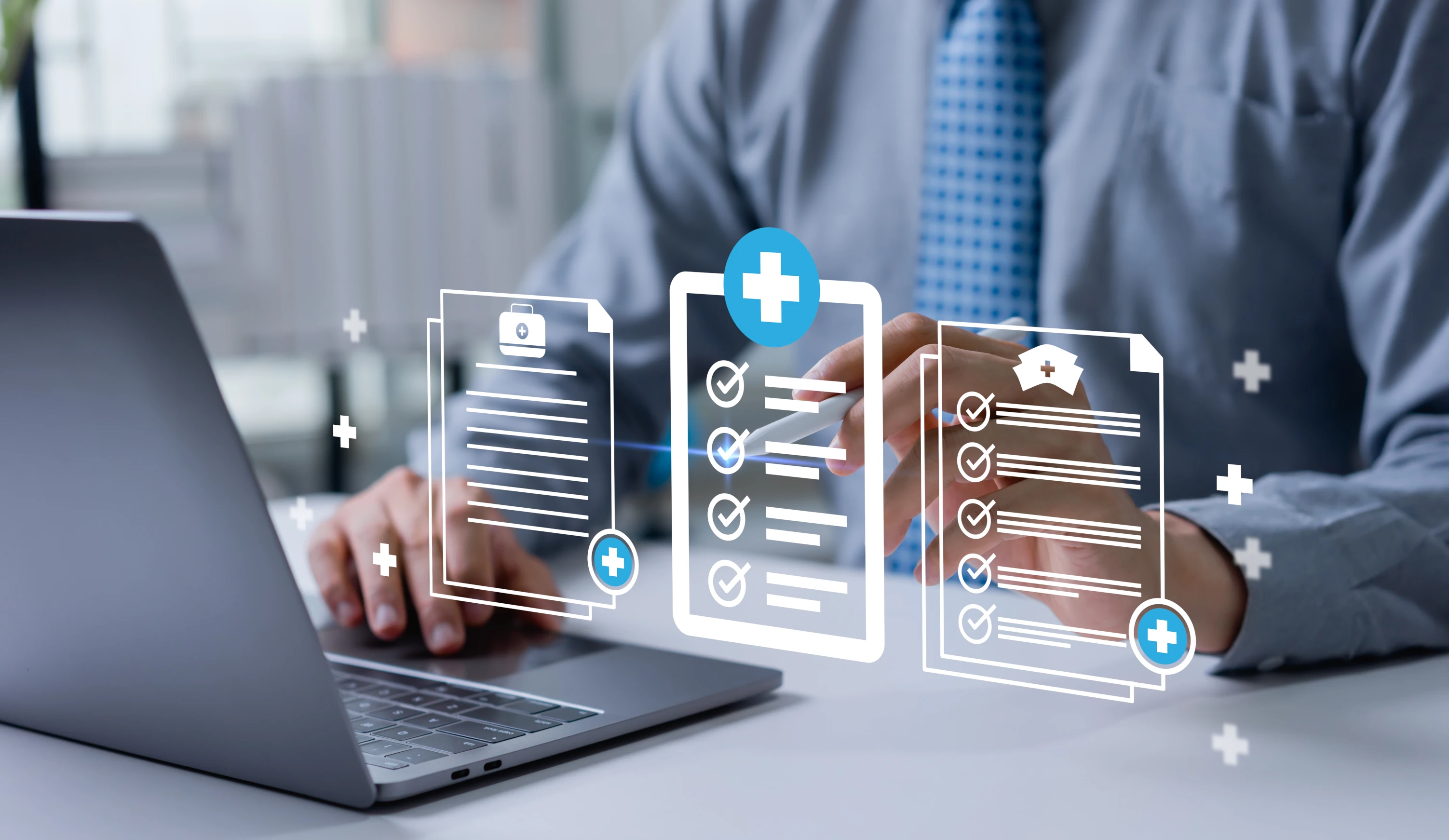 Person in suit using laptop with floating digital medical checklist icons around their hands.