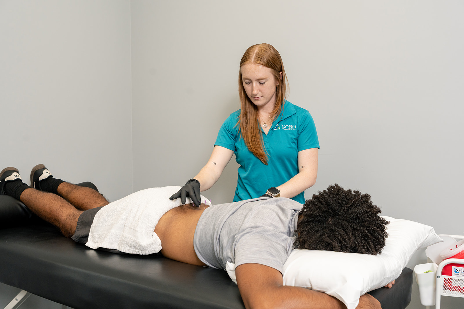 Physical therapist completing hands-on dry needling certification training