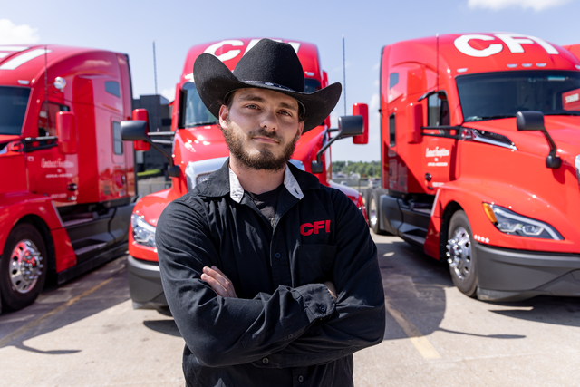 Picture of a driver and trucks at the back