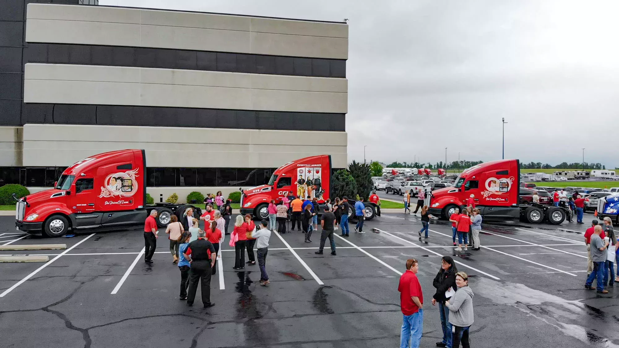 Group picture of people and trucks