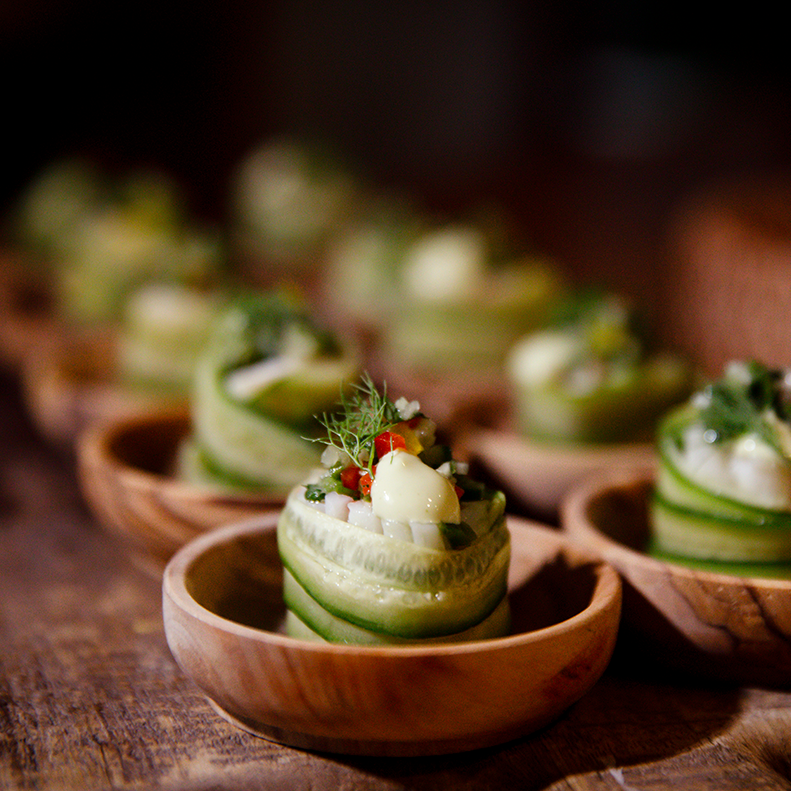Cucumber dish served in wooden bowls