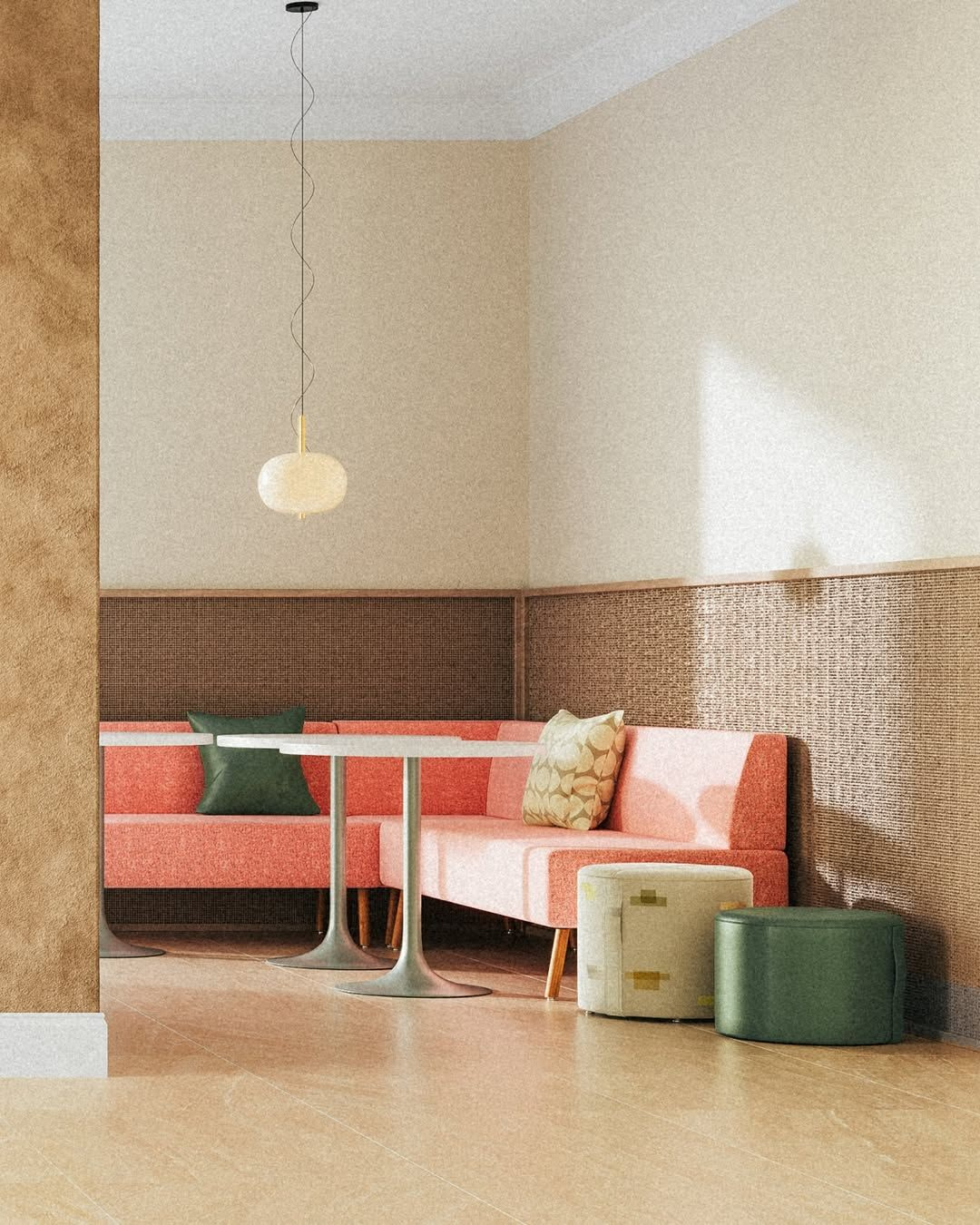 Modern corner seating area with coral upholstered benches, round tables, green and beige cushions, and two small upholstered stools.