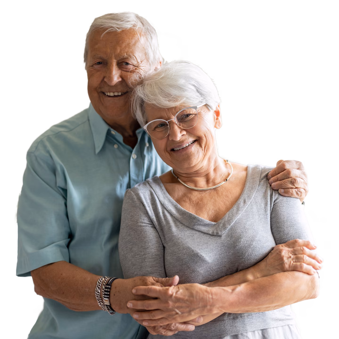 Two older adults, one male and one female, embracing in a portrait, representing companionship and support in later life.