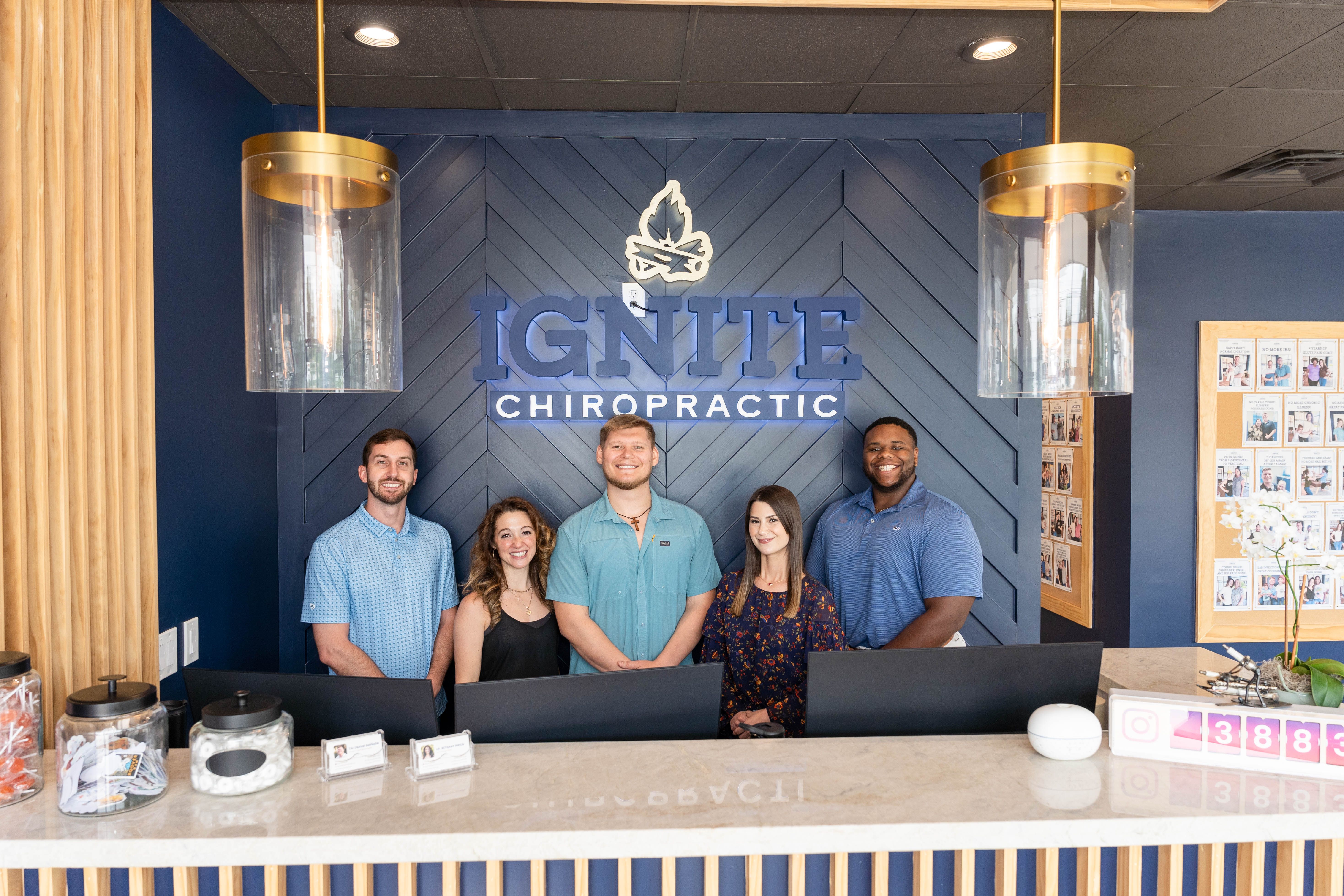 Chiropractor analyzing nerve scan results to customize personalized care plan at Ignite Chiropractic clinic.