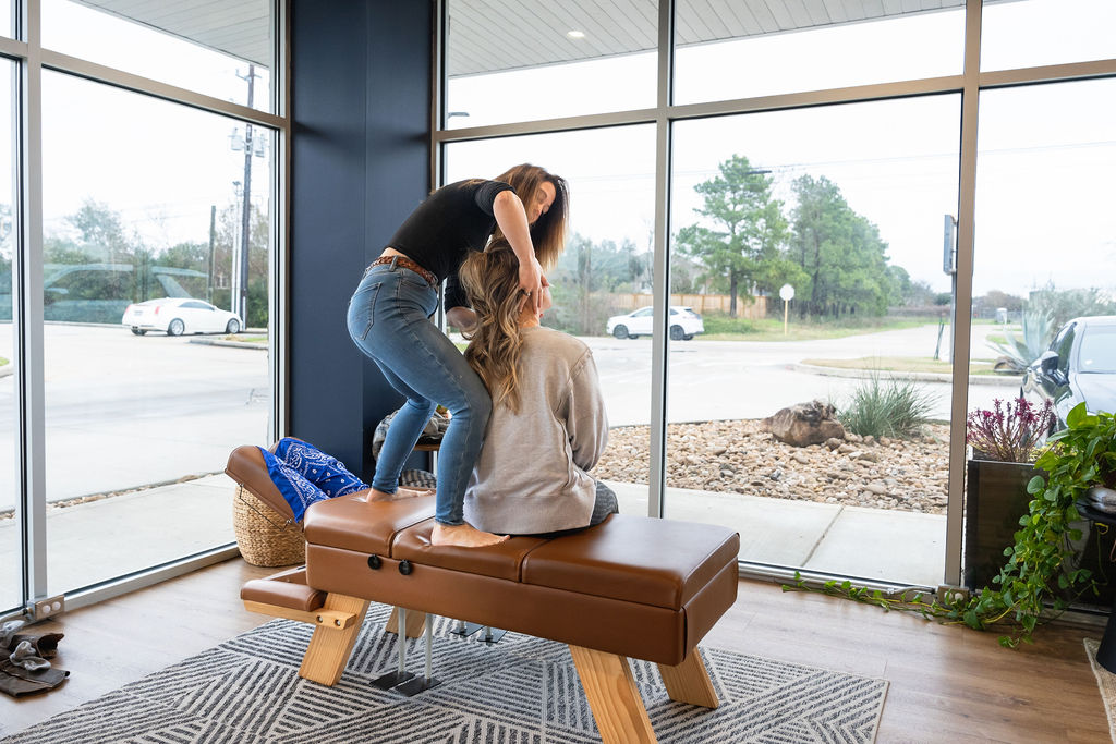 Holistic chiropractor providing gentle care to patient in Cypress TX