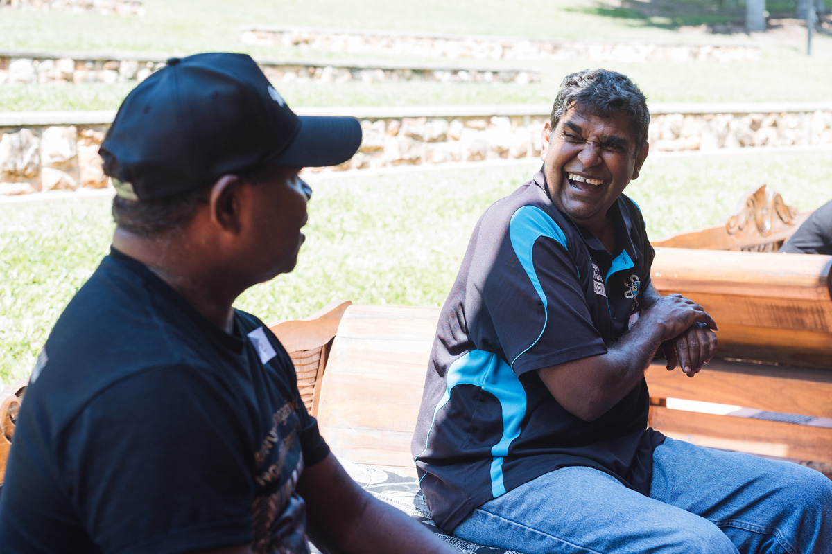 Two people chatting at an Impact North event.