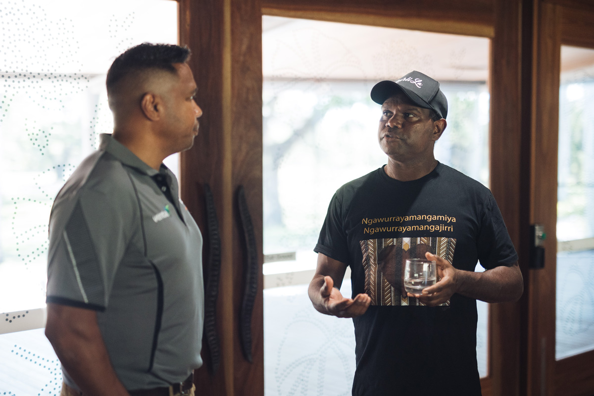 Two people networking at an Impact North event.