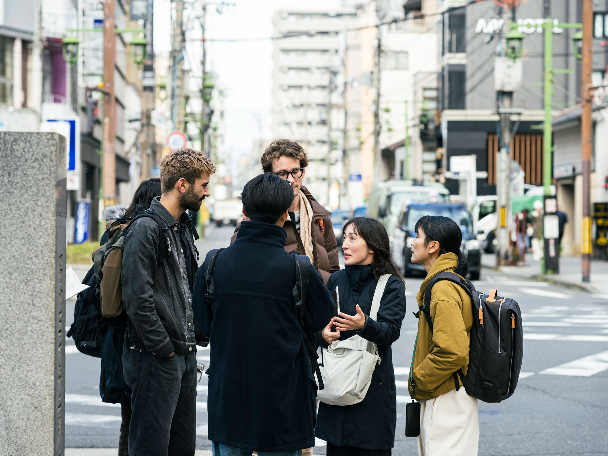 group of people on walking tour in downtown Kyoto