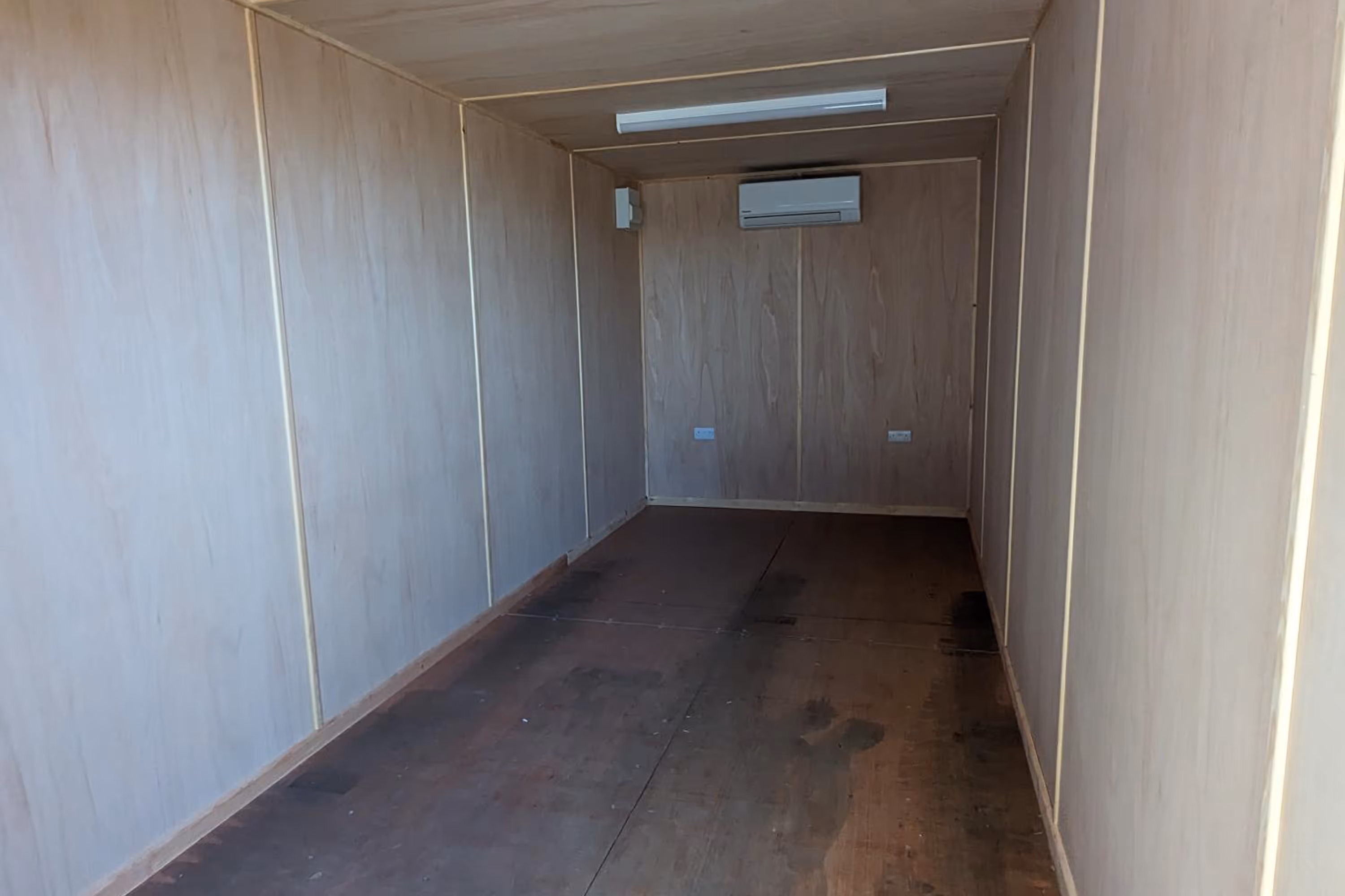 A white wooden wall with a doorway.