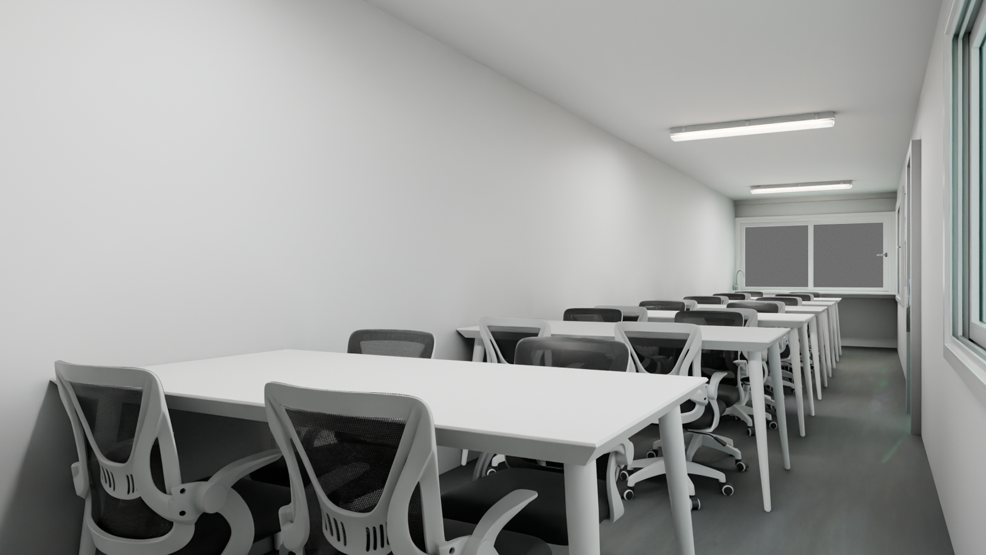 Minimalist classroom with rows of white desks and black mesh office chairs under fluorescent ceiling lights.
