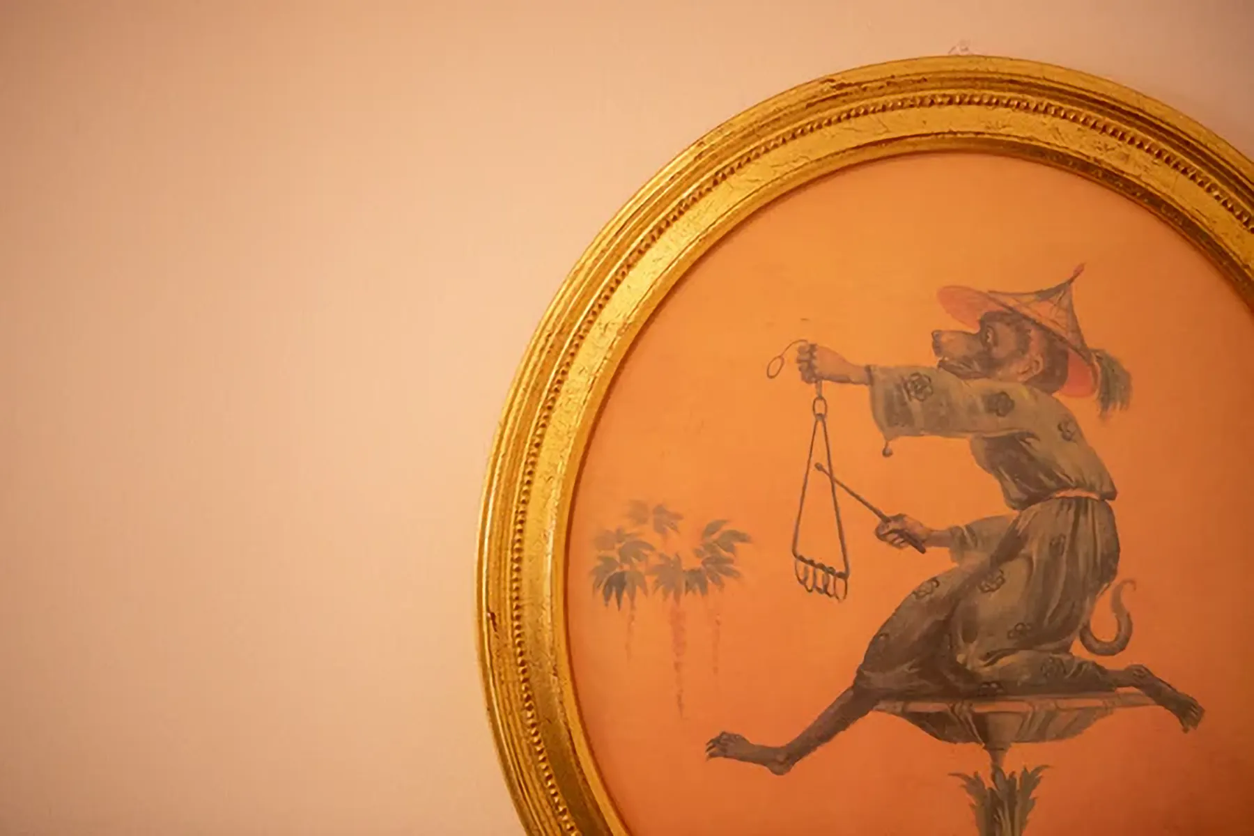 A framed picture of a dancing rat