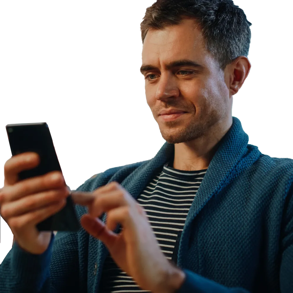 Man focused on reviewing information displayed on his mobile phone