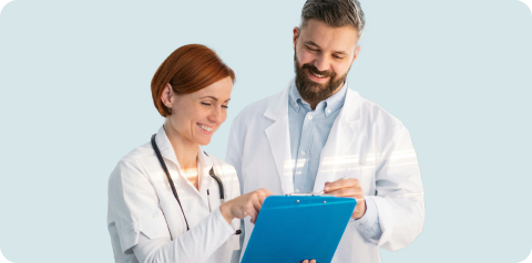 Two doctors collaborating while using a tablet with the Epocrates app for medical information and patient care.