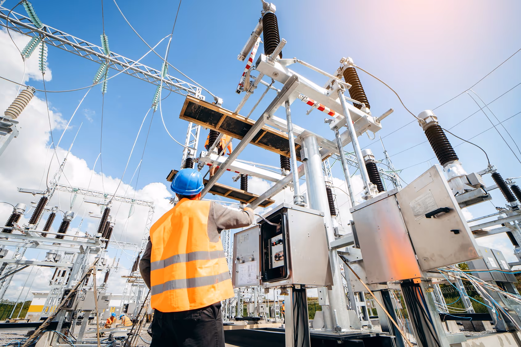 Electrical workers on the job with power grid