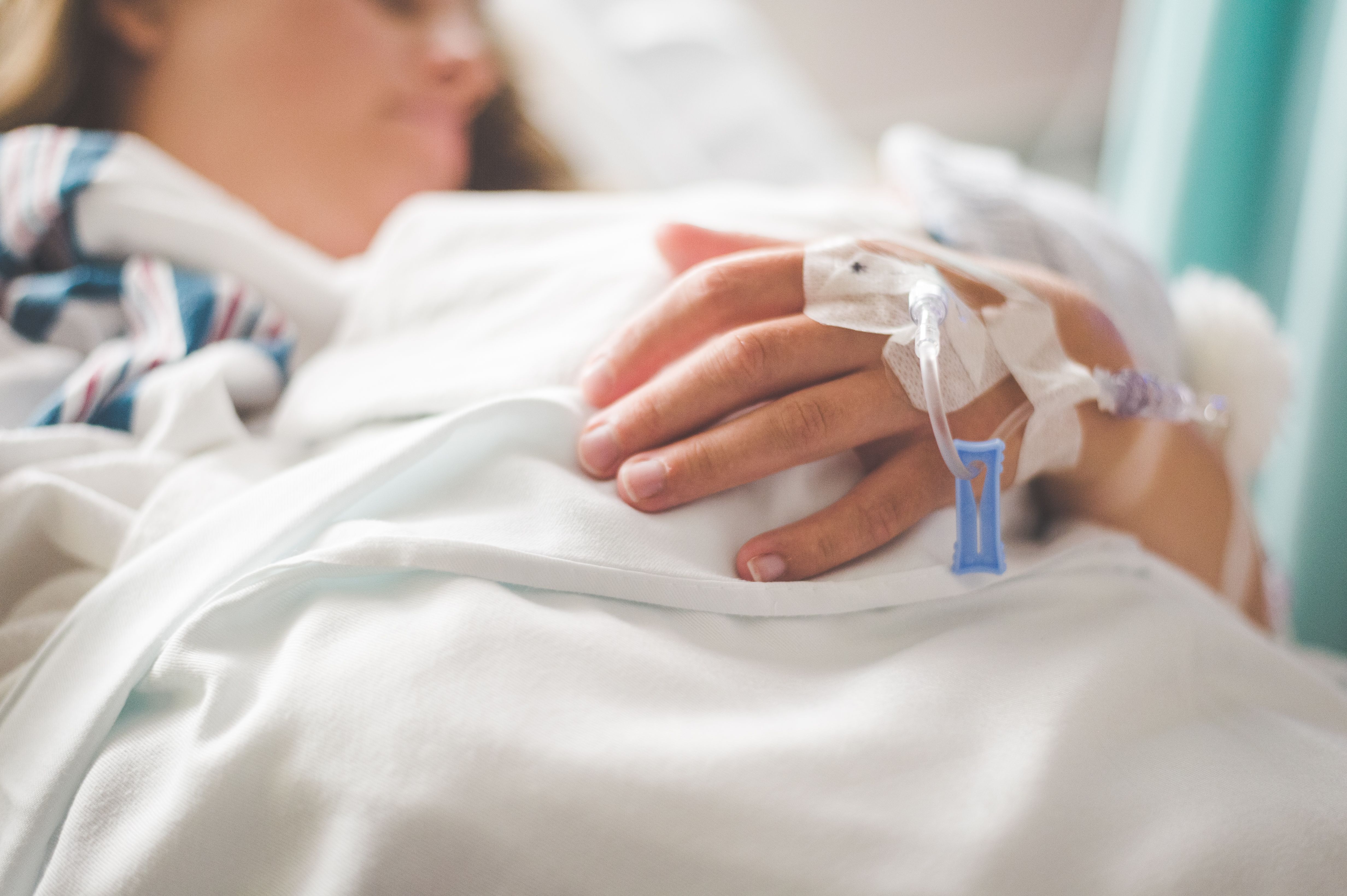 IV line in a patient's hand during hospital-level withdrawal treatment