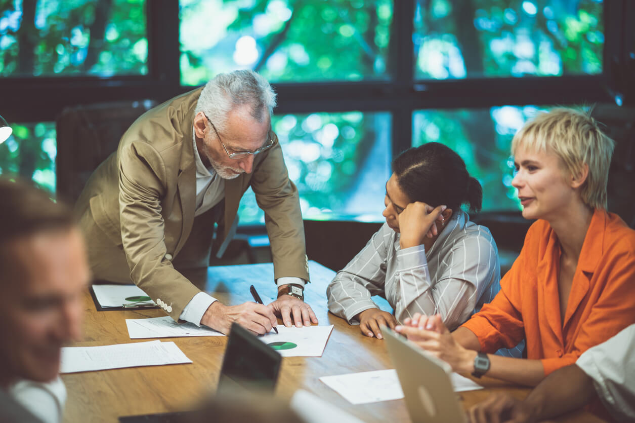 A group of leaders from a large church reviews a budget plan in an office