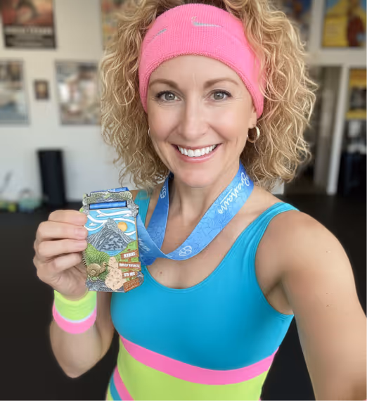 Woman with Kiwi Wild Track medal