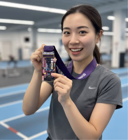 Woman with Tokyo medal