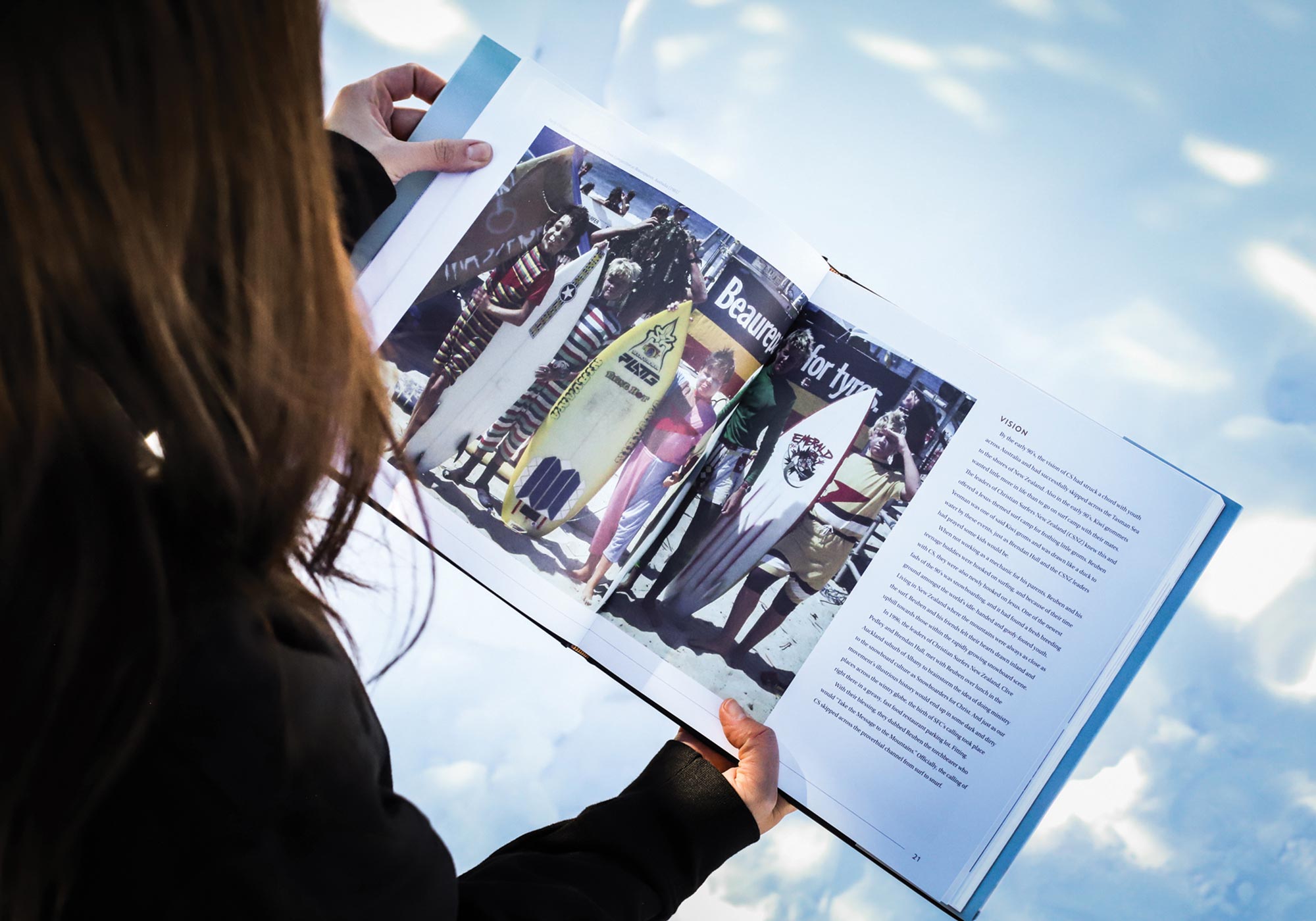 Photo of the book design opened up in a readers hands.