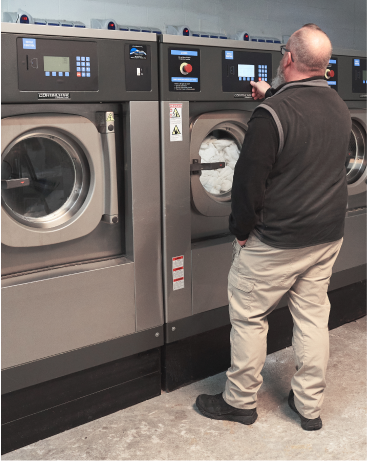 Close up image of a laundry machine