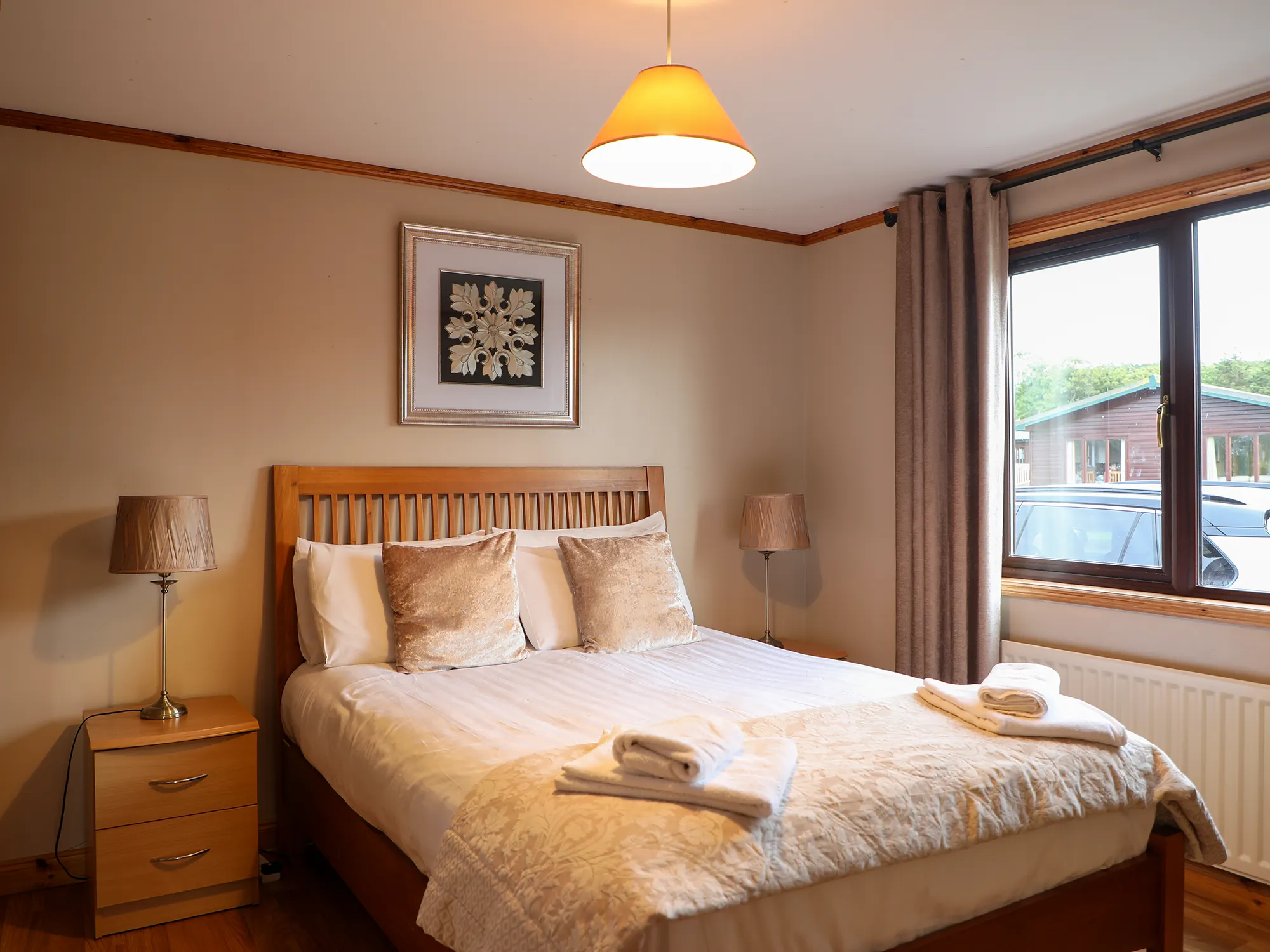 Bright holiday cabin living room overlooking Mulroy Bay