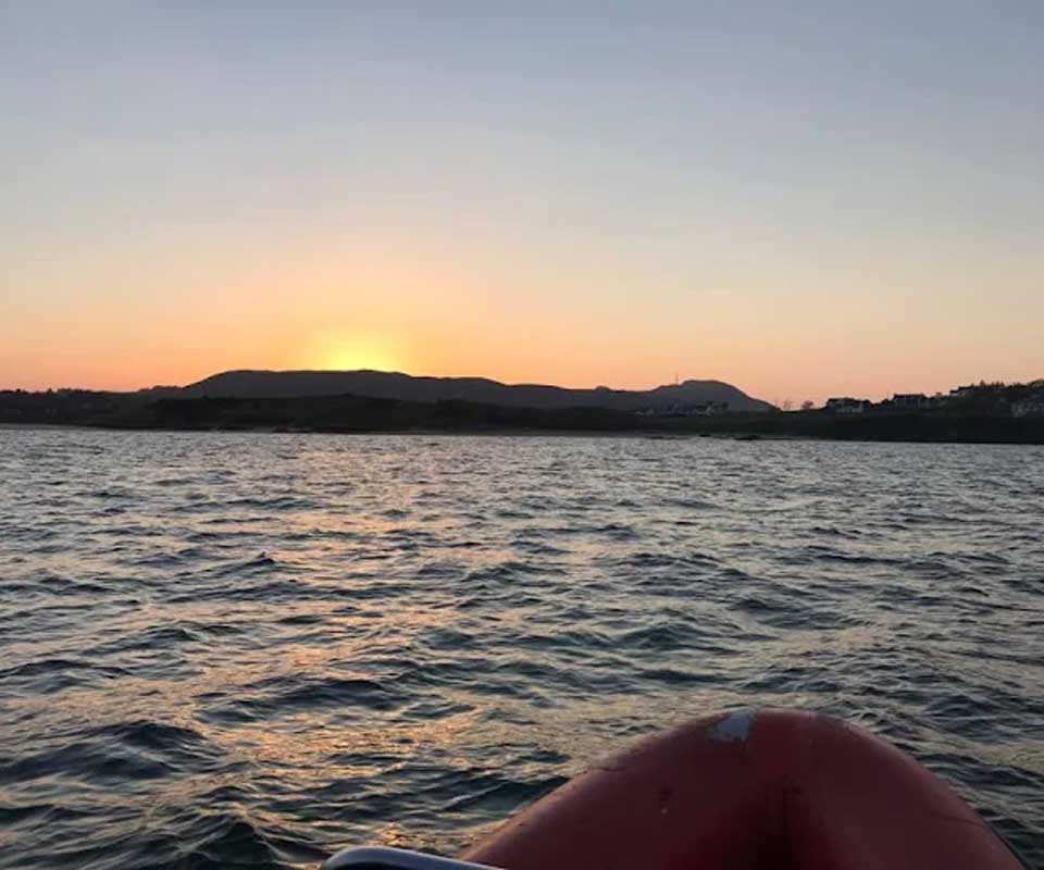 Sunset over Mulroy Bay viewed from the water