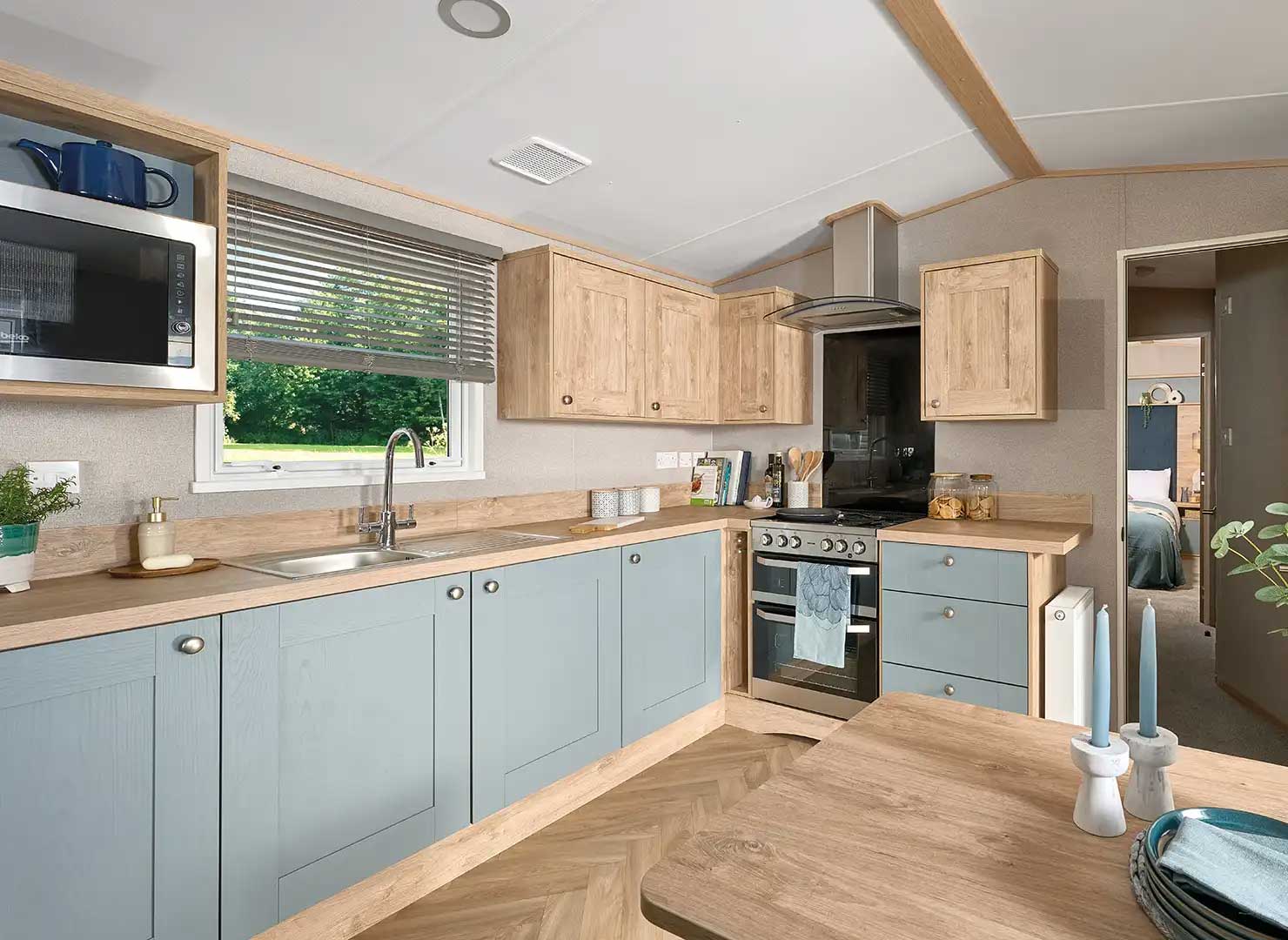 Blue and wood-finish kitchen in the ABI Wimbledon