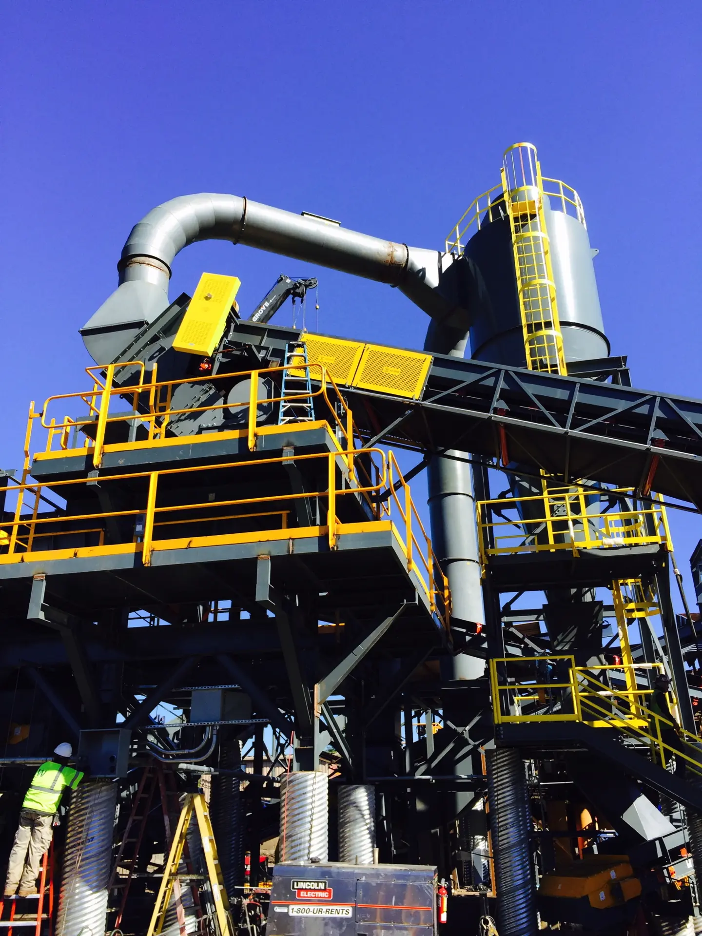 Air Systems industrial dust collection and pneumatic transfer system with custom ducting and elevated support structure