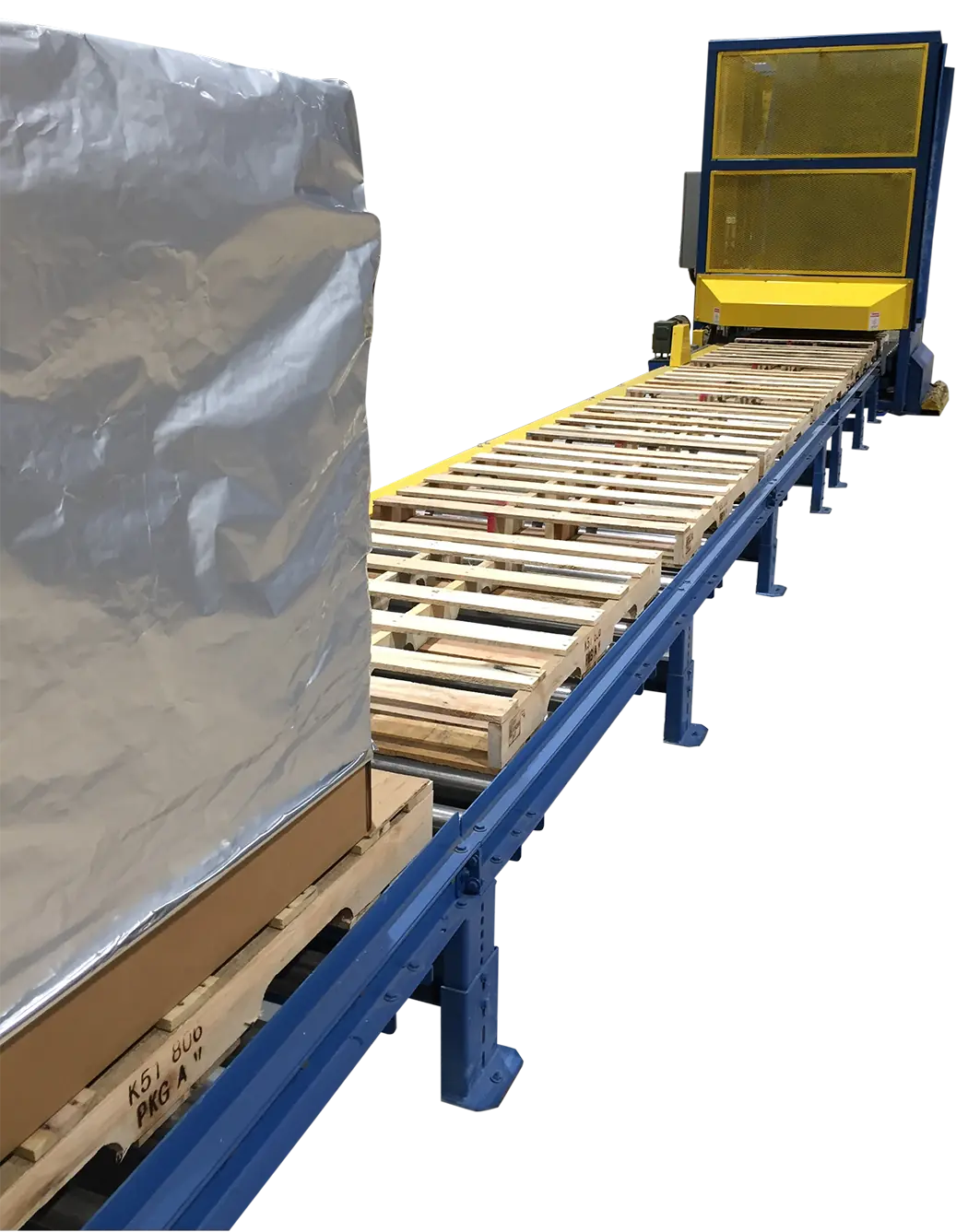 Pallet Destackers transporting wrapped pallet load on long conveyor line in industrial facility.  Pallet Destackers in operation with pallet stacks loaded into automated destacking machine