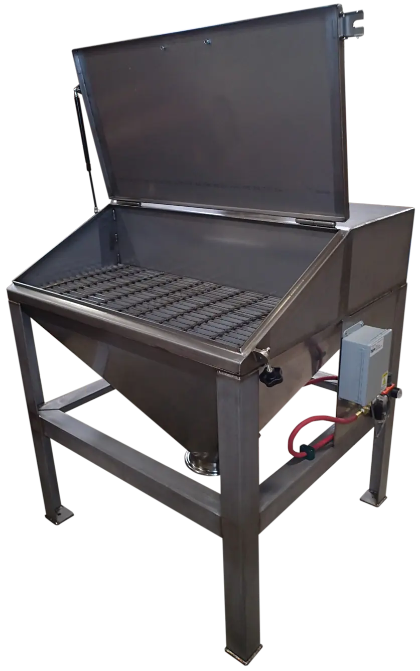 Bag dump station with open lid and safety grate for controlled bulk material transfer