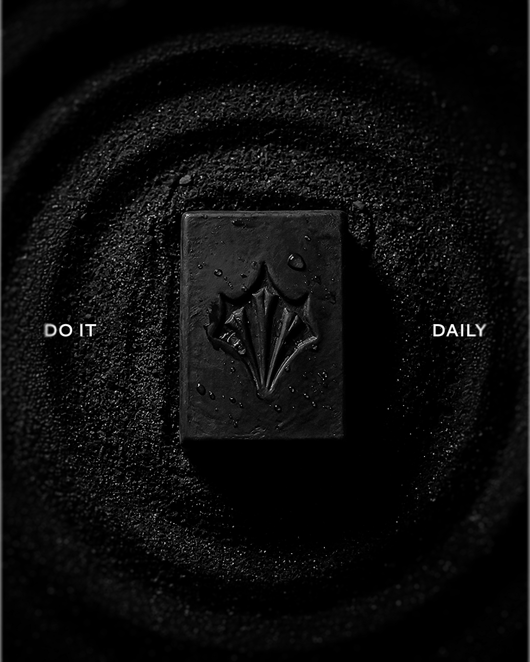 Black soap bar embossed with the Throne logo