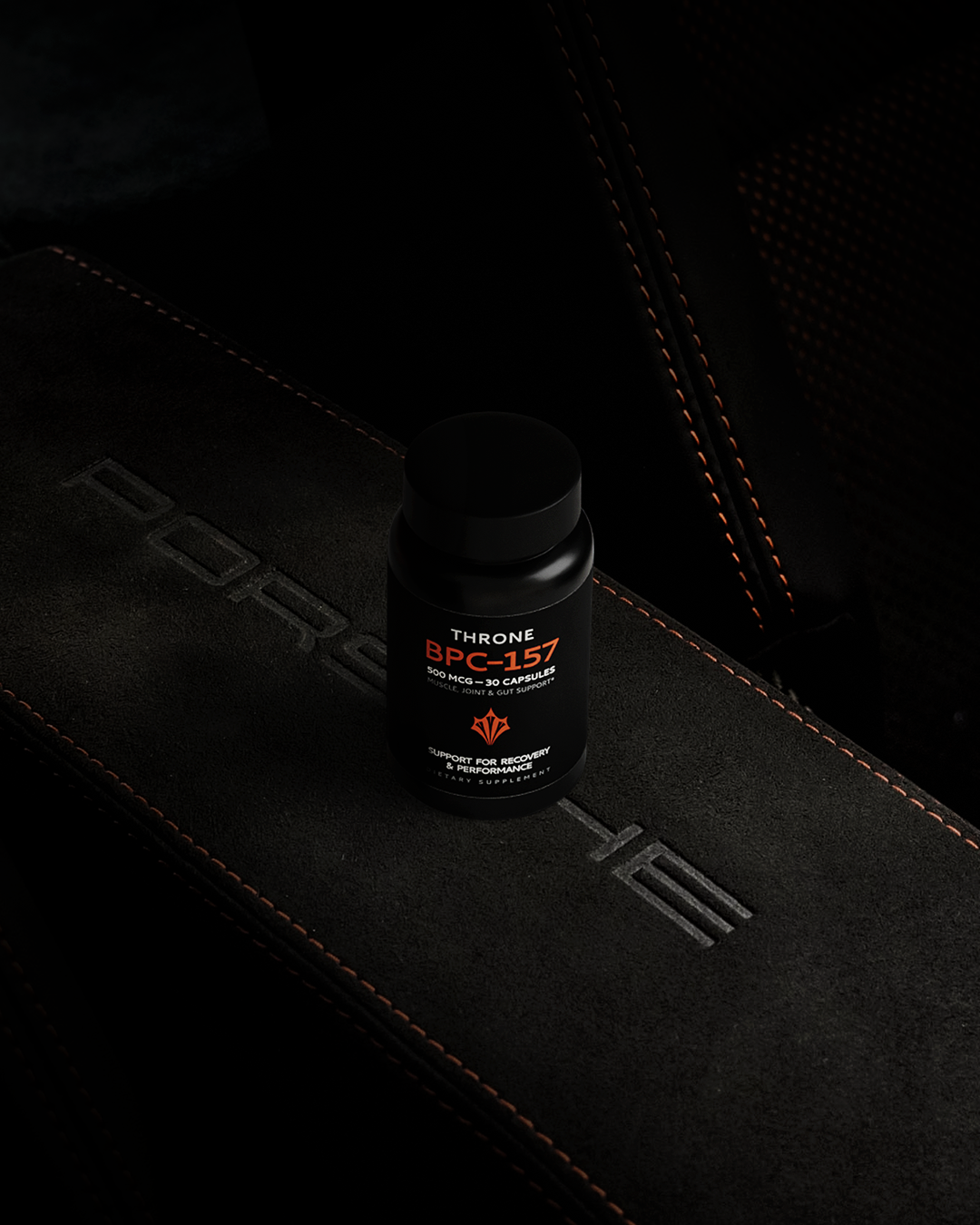 Throne skincare packaging detail with orange brand accents