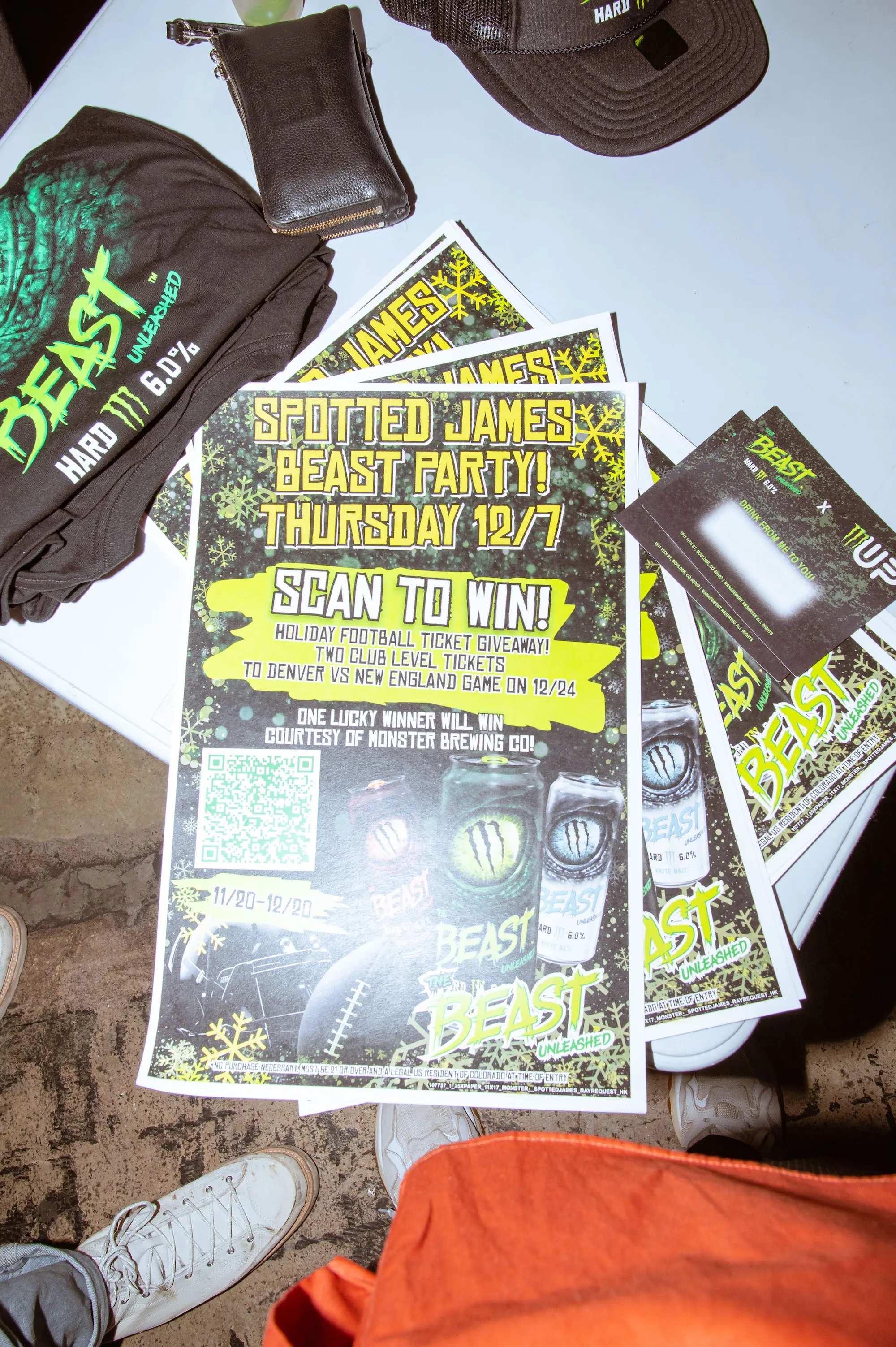 Monster The Beast Unleashed Spotted James party flyers, merch, and giveaway cards on a table