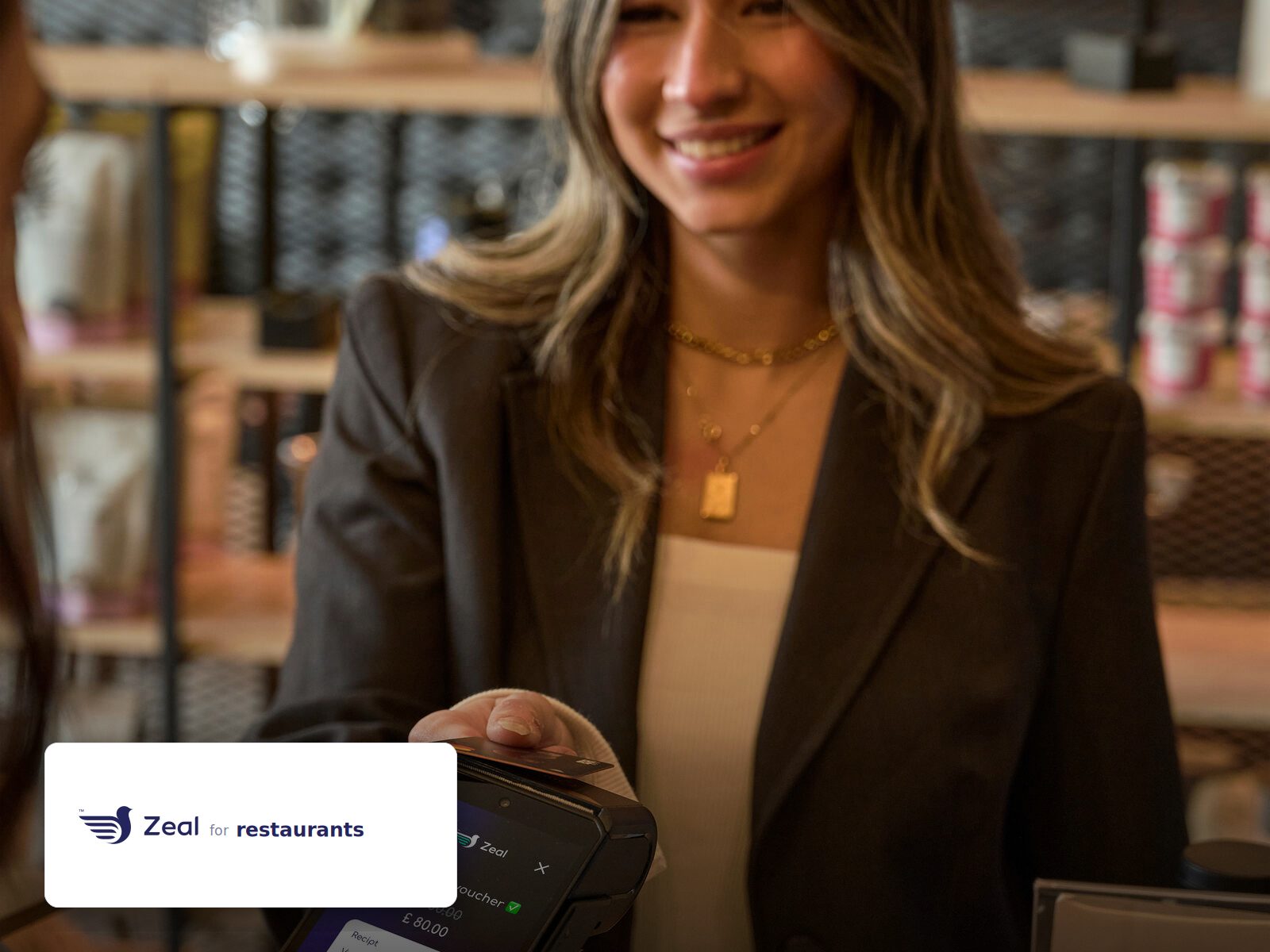 Staff and customer at the counter with a Zeal-enabled card machine