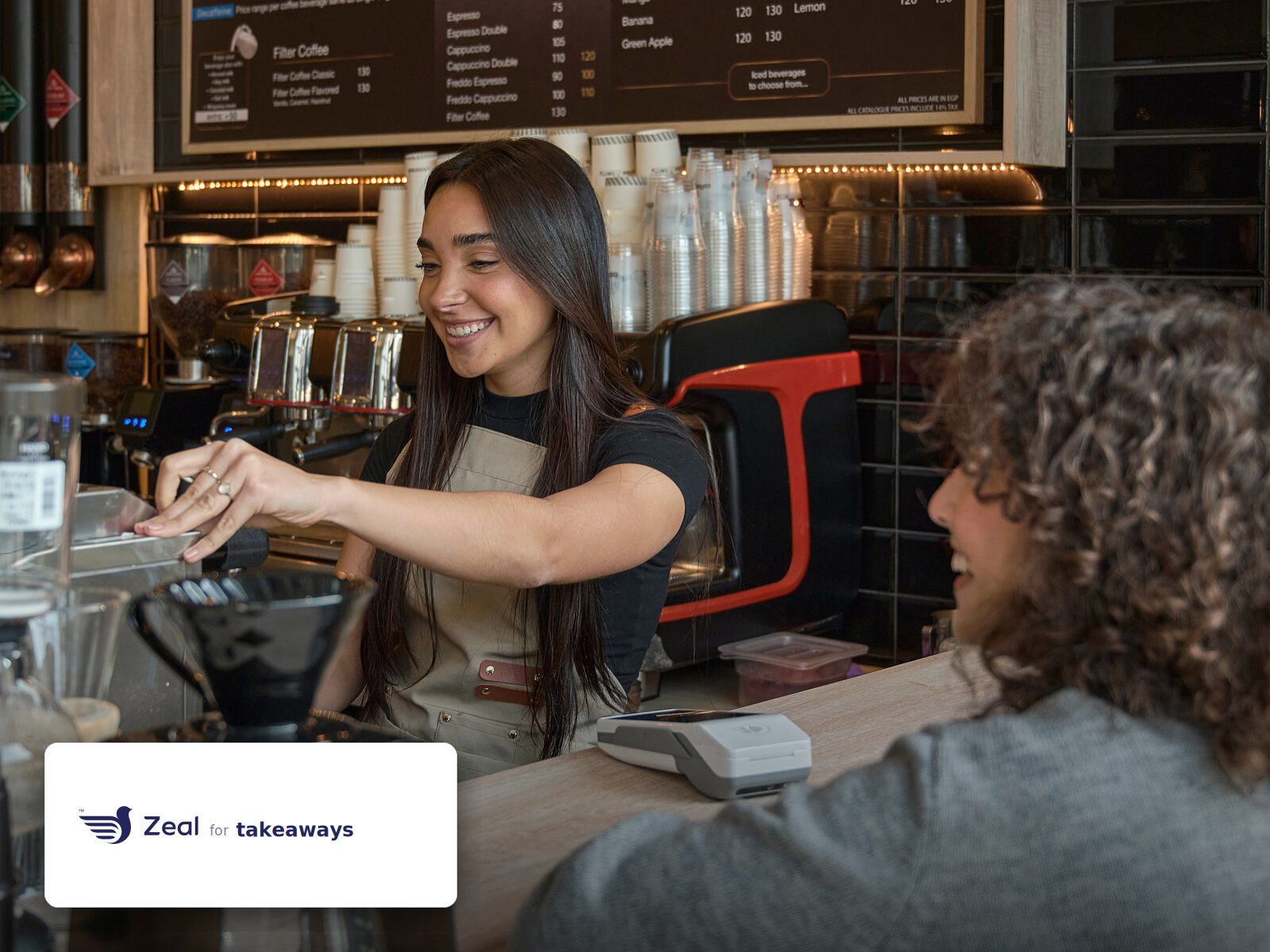 Staff and customer at the counter with a Zeal-enabled card machine