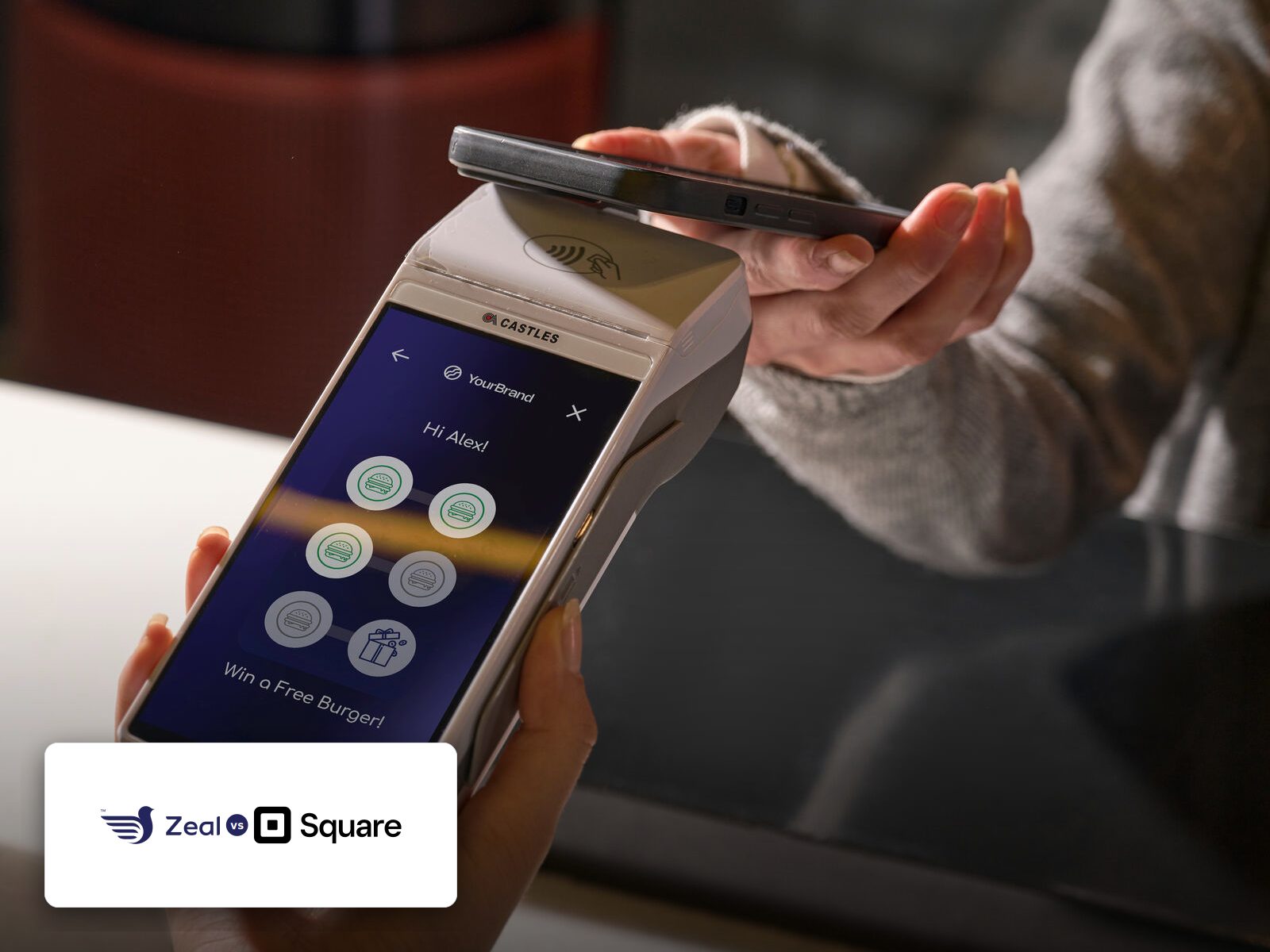 Customer tapping a phone on a Zeal-enabled card machine showing loyalty stamps