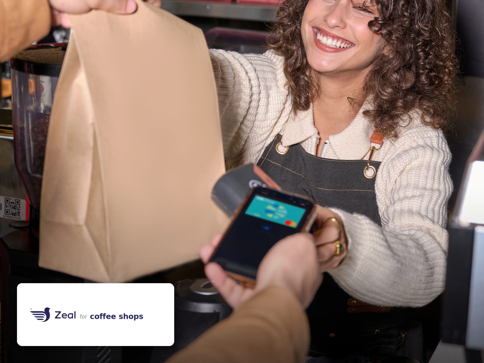 Staff and customer at the counter with a Zeal-enabled card machine