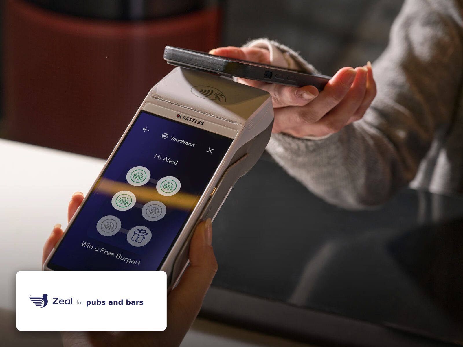 Staff and customer at the counter with a Zeal-enabled card machine