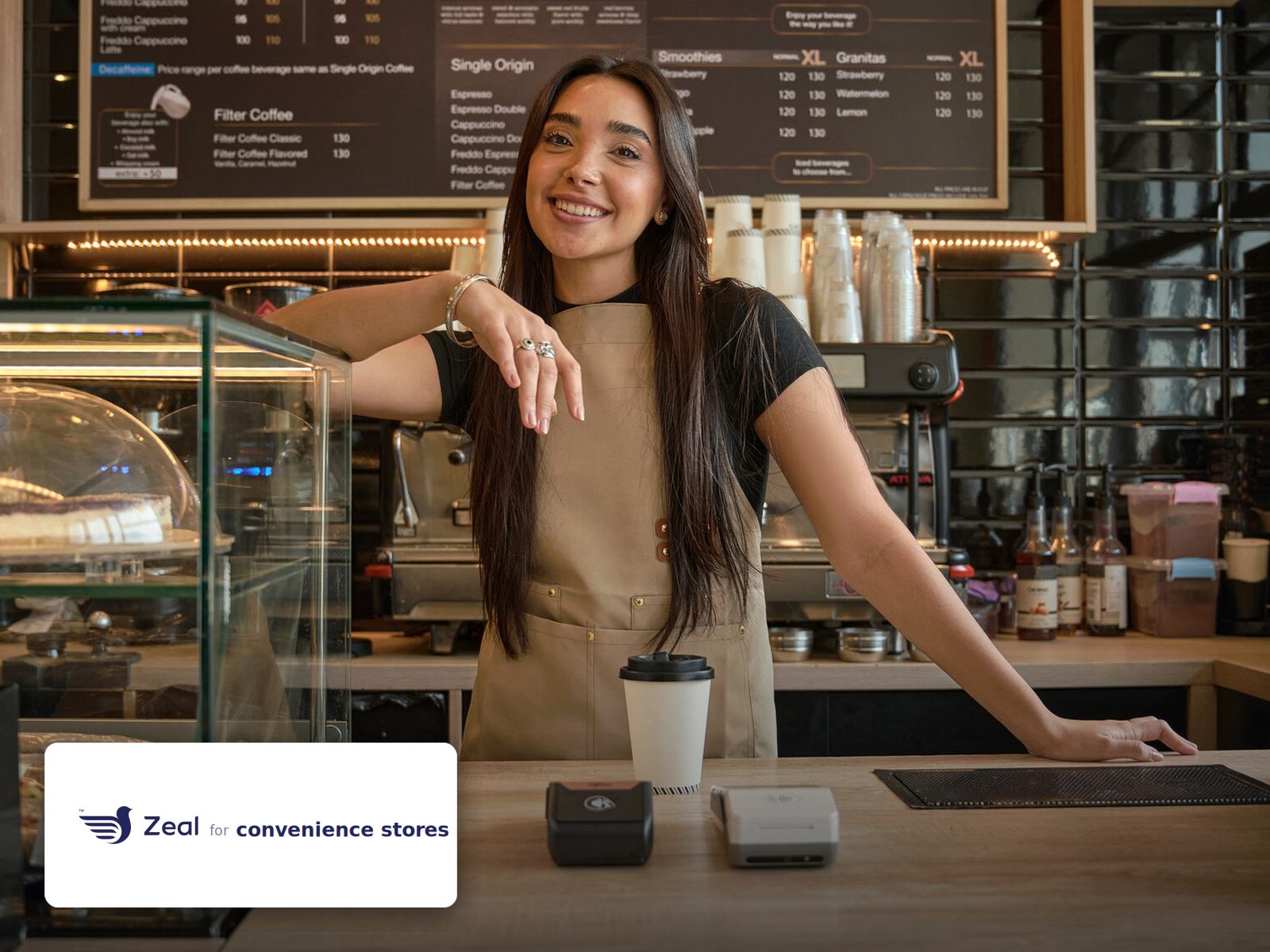 Staff and customer at the counter with a Zeal-enabled card machine