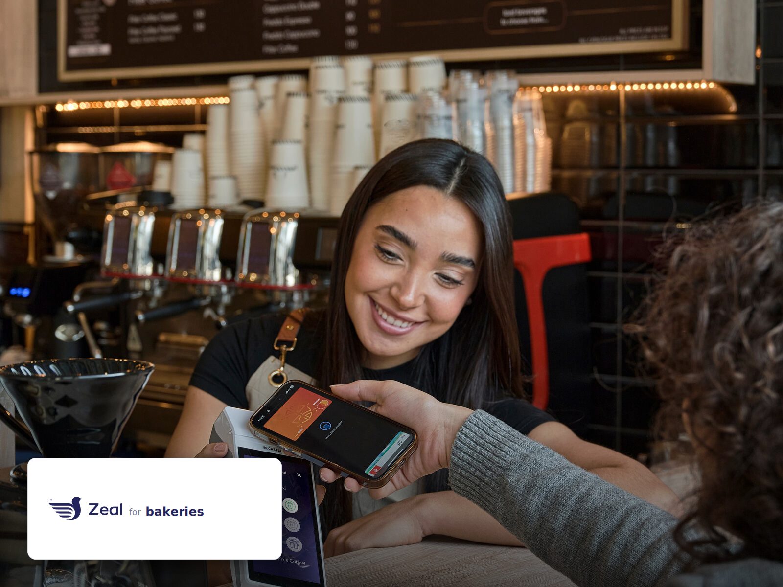 Staff and customer at the counter with a Zeal-enabled card machine