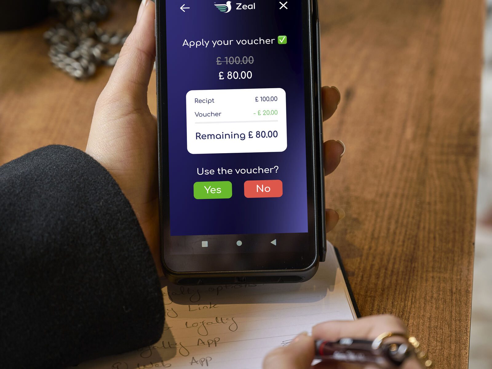 Payment terminal voucher redemption screen hand closeup