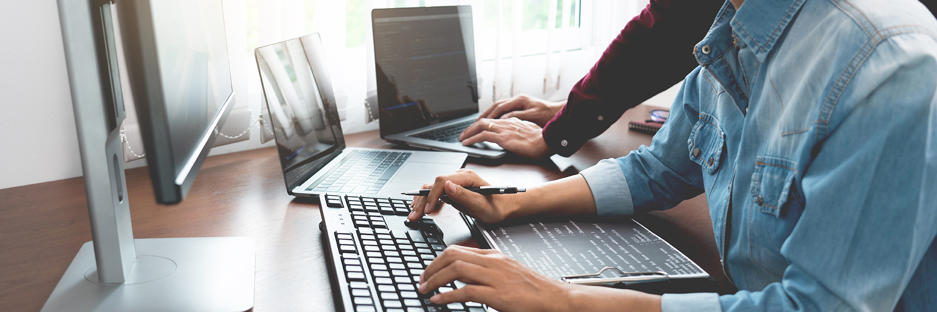 Support staff typing on a keyboard